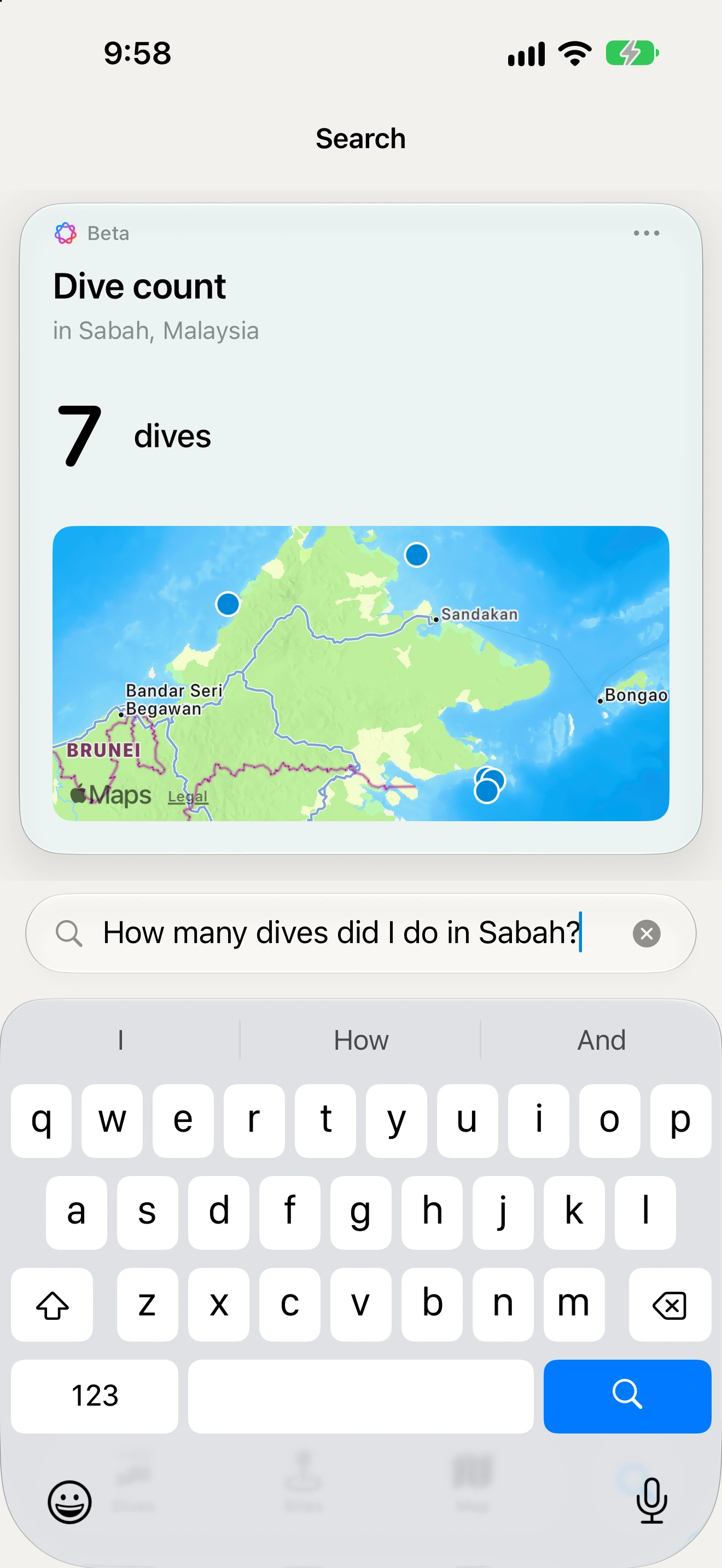 Interval answering “How many dives did I do in Sabah?” with seven dives and a map of the matching sites, with the search field and keyboard visible.